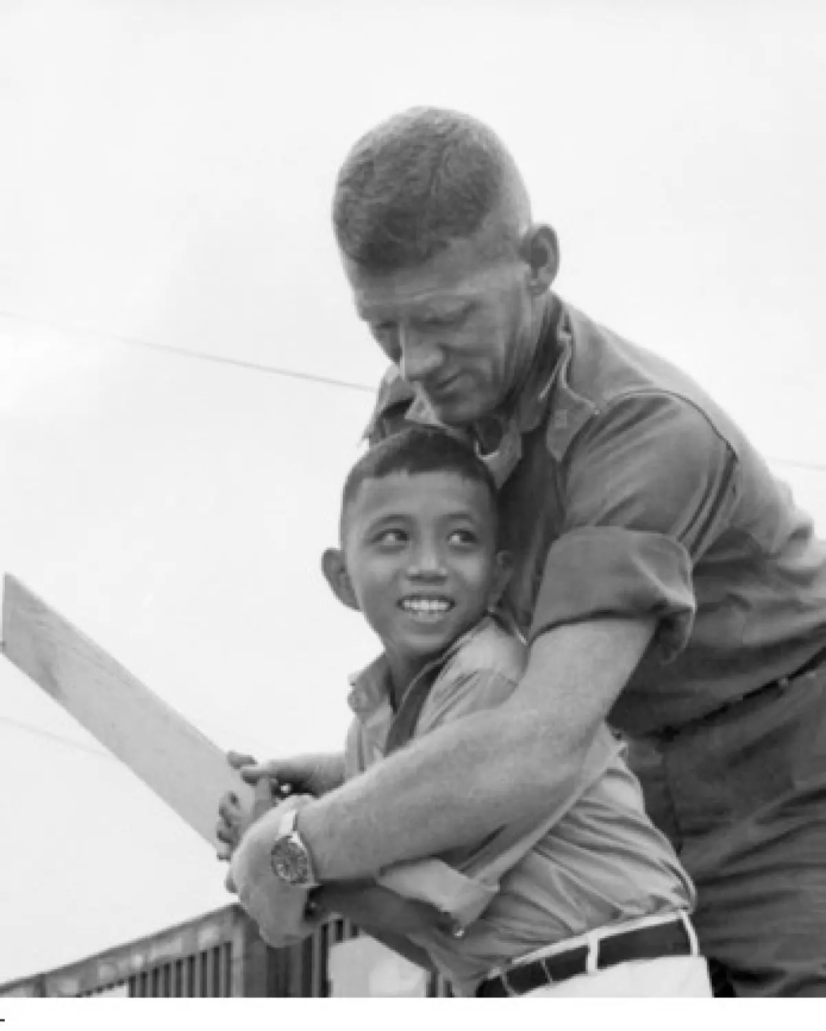 Historic cricket moment captures Australian soldier teaching orphaned Vietnamese boy during war
