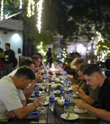 Team enjoys a vibrant dinner with heartfelt laughs, stories, and unity for all.