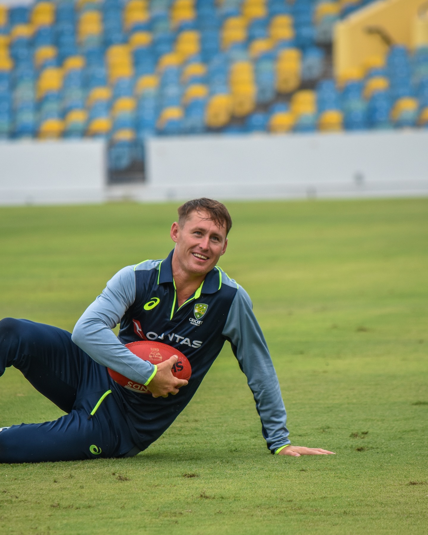 Aussie Cricketers Embrace Footy Fun Amid Rain Delay