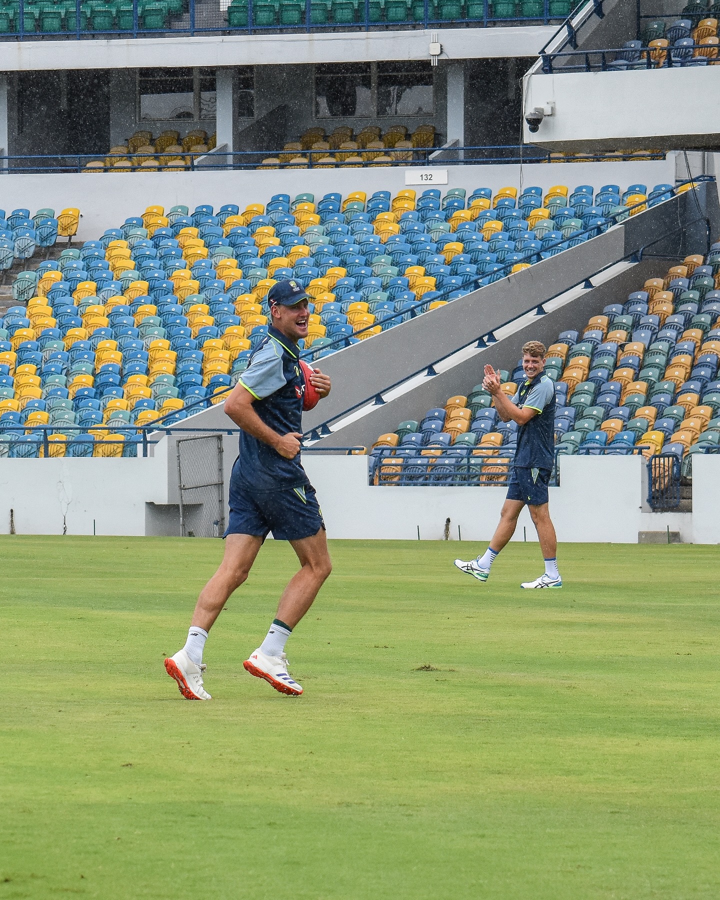 Aussie Cricketers Embrace Footy Fun Amid Rain Delay