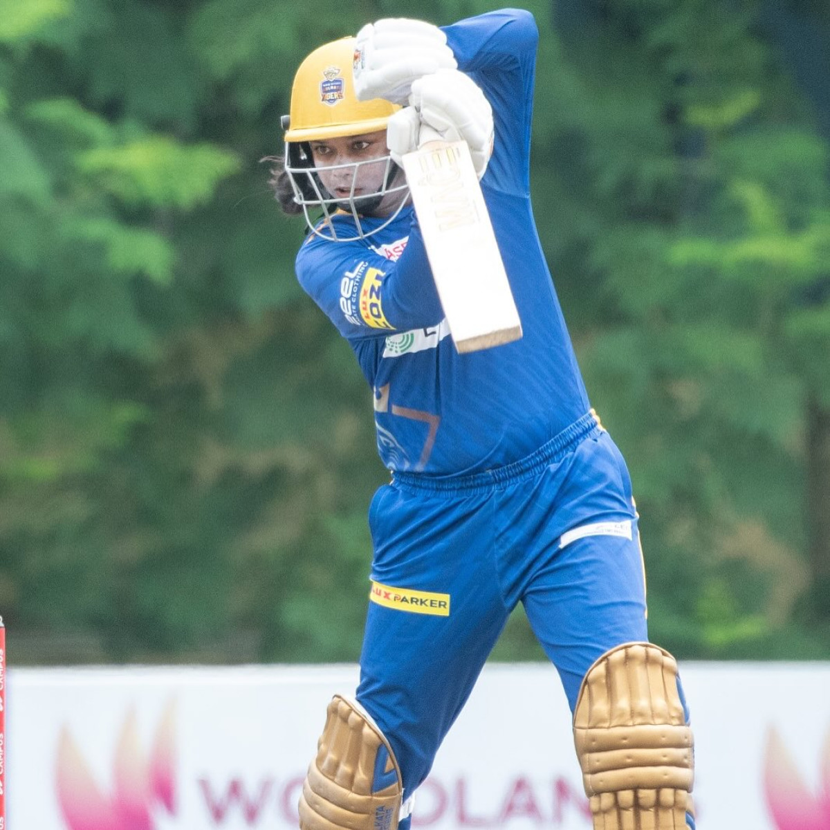 Defending champions clinch their semi-final spot with a four-run triumph in intense battle.