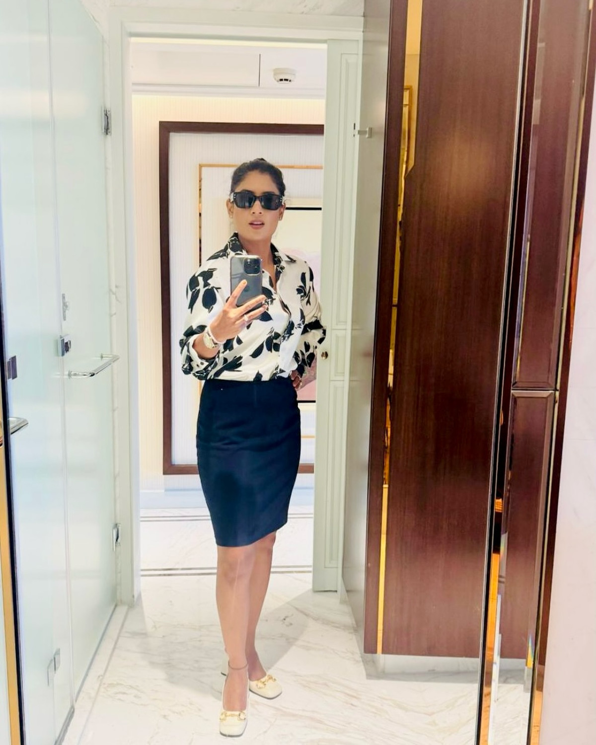 Mithali Raj Shares Minimalist Mirror Moment Cricket icon Mithali Raj unveils sleek monochrome selfie exuding timeless class with grace.
