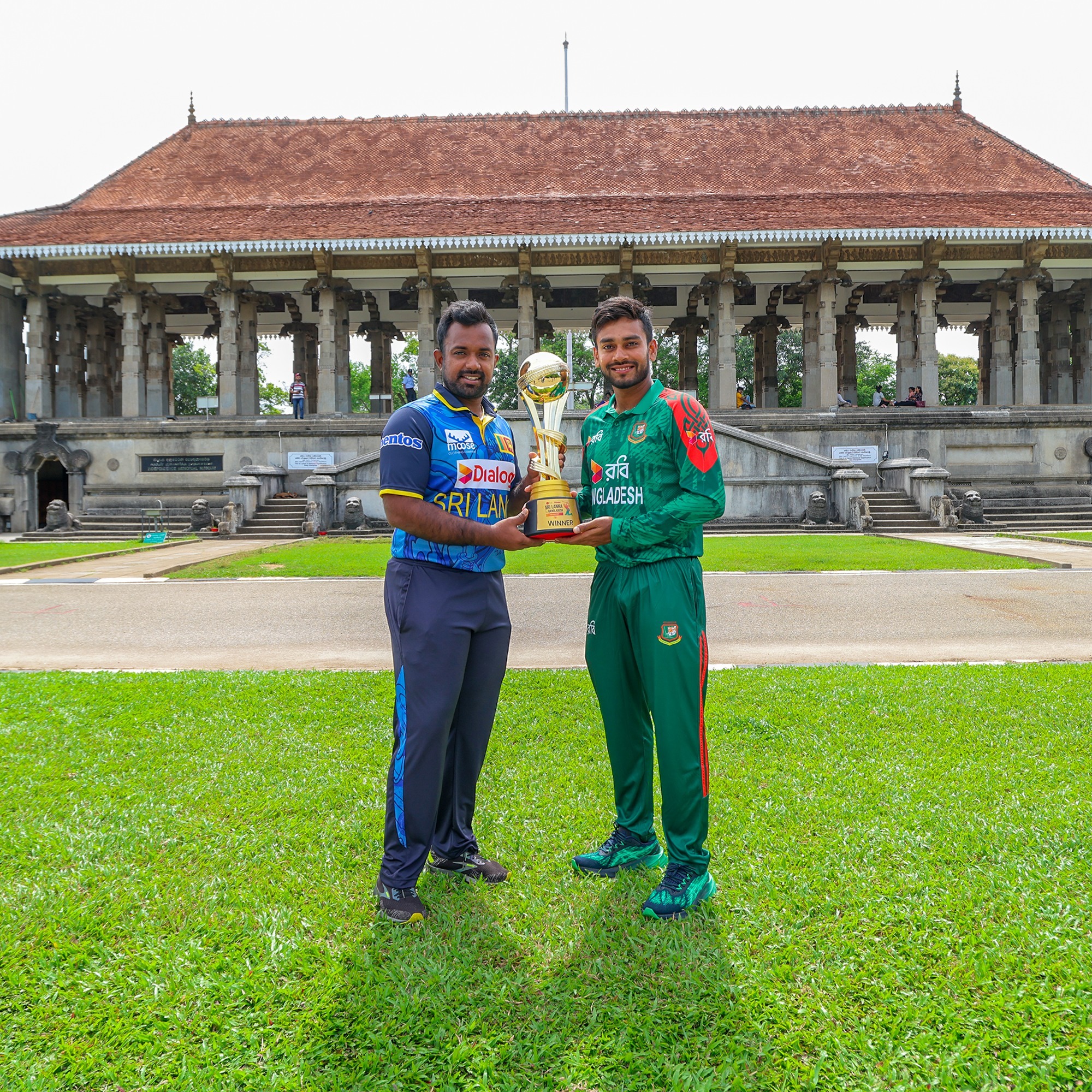 Sri Lankas Charith Asalanka and Bangladeshs Mehidy Hasan Miraz unveil ODI-trophy at Colombo.